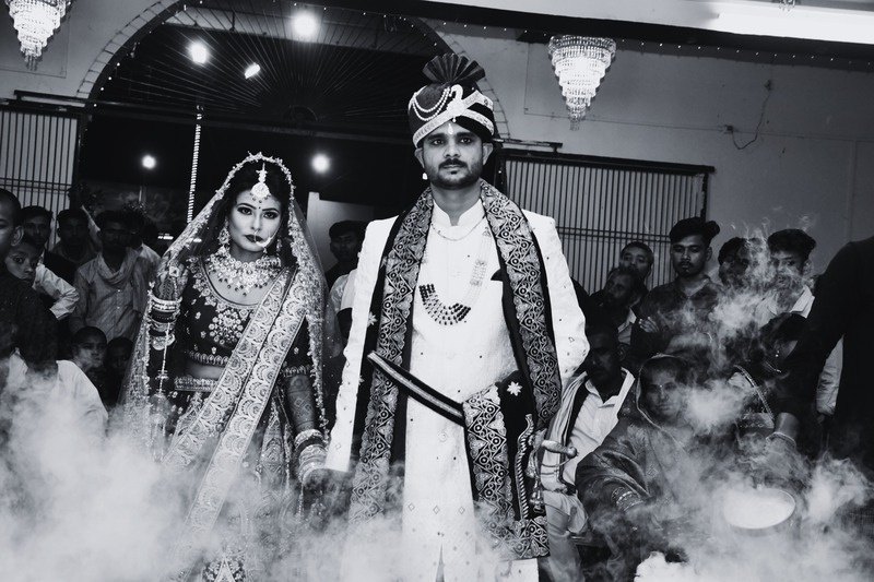 Wedding couple in a monochrome processional portrait